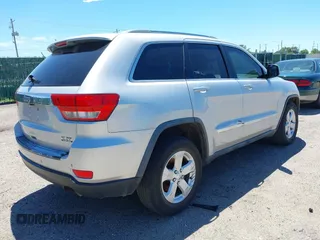 2011 Jeep Grand Cherokee Laredo with VIN 1J4RR4GG2BC737400, listed as a IAAI auction lot 42259167 with 153,211 mi miles and . Bid and sale history available at DreamBid. Image 4.