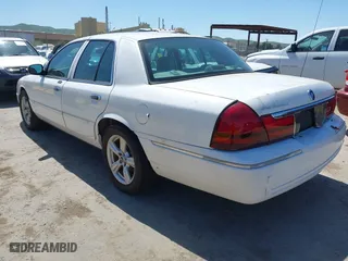 2005 Mercury Grand Marquis LS Premium with VIN 2MEFM75W15X631500, listed as a IAAI auction lot 42042103 with 164,810 mi miles. Bid and sale history available at carsss.com. Image 3.