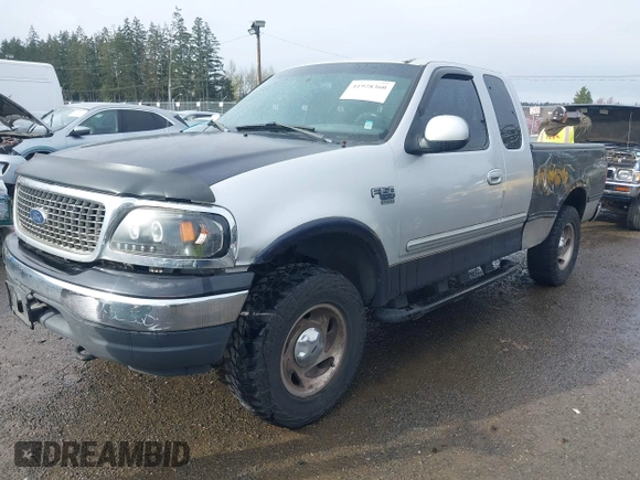 2000 Ford F-150 XL z VIN 1FTRX18L8YKA72409, wystawiony jako IAAI lot #41928360 z przebiegiem 167 251 mil mil oraz . Historia ofert i sprzedaży dostępna na DreamBid. Obrazek 2.