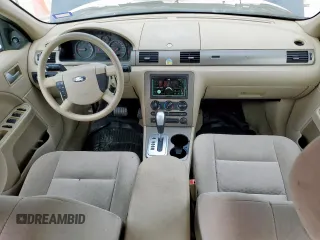 2005 Ford Five Hundred SE z VIN 1FAFP23135G175790, wystawiony jako Copart lot #56588085 z przebiegiem 117 354 mil mil oraz Szkody całkowita. Historia ofert i sprzedaży dostępna na DreamBid. Obrazek 8.