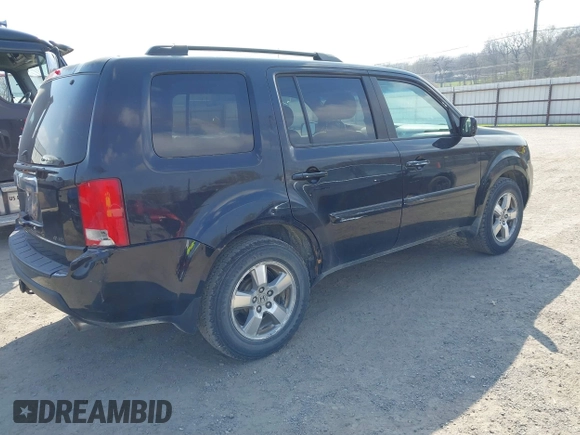 2009 Honda Pilot EX-L with VIN 5FNYF48529B035128, listed as a IAAI auction lot 42006450 with 214,069 mi miles. Bid and sale history available at carsss.com. Image 4.
