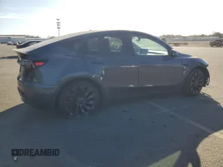 2022 Tesla Model Y Performance z VIN 7SAYGDEF5NF338301, wystawiony jako Copart lot #78189114 z przebiegiem 55 881 mil mil oraz Szkody całkowita. Historia ofert i sprzedaży dostępna na DreamBid. Obrazek 3.