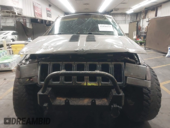 1998 Jeep Grand Cherokee Laredo with VIN 1J4GZ48Y9WC206957, listed as a IAAI auction lot 41848433 with 122,104 mi miles. Bid and sale history available at carsss.com. Image 12.
