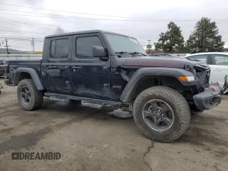 2023 Jeep Gladiator Rubicon with VIN 1C6JJTBG6PL500516, listed as a Copart auction lot 43432015 with 107,096 mi miles and Salvage title. Bid and sale history available at DreamBid. Image 4.