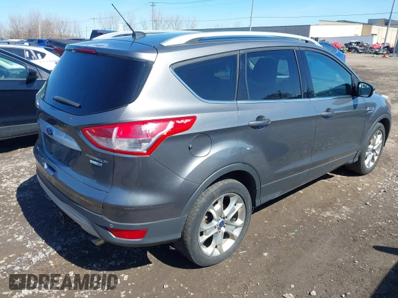 2014 Ford Escape Titanium with VIN 1FMCU9JX1EUB94776, listed as a IAAI auction lot 42063678 with 138,036 mi miles. Bid and sale history available at carsss.com. Image 4.