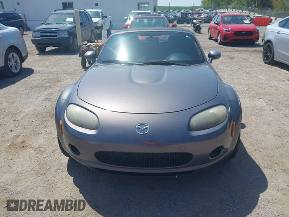 2007 Mazda MX-5 Miata Sport z VIN JM1NC25F570130226, wystawiony jako IAAI lot #42227544 z przebiegiem 150 035 mil mil oraz . Historia ofert i sprzedaży dostępna na DreamBid. Obrazek 13.