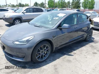 2023 Tesla Model 3 with VIN 5YJ3E1EA4PF400306, listed as a IAAI auction lot 42398603 with 18,551 mi miles and . Bid and sale history available at DreamBid. Image 2.