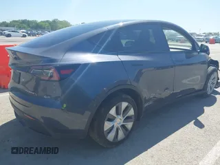2023 Tesla Model Y Long Range with VIN 7SAYGDEE4PA037218, listed as a IAAI auction lot 42232704 with 18,756 mi miles and . Bid and sale history available at DreamBid. Image 4.