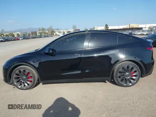 2023 Tesla Model Y Performance with VIN 7SAYGDEF4PF809308, listed as a IAAI auction lot 42056769 with 12,101 mi miles and . Bid and sale history available at DreamBid. Image 13.
