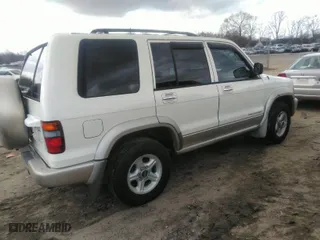 1999 Isuzu Trooper S with VIN JACDJ58XXX7904757, listed as a IAAI auction lot 41730227 with 233,823 mi miles. Bid and sale history available at carsss.com. Image 4.