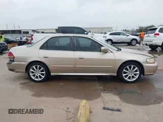 2001 Honda Accord EX z VIN 1HGCG165X1A077702, wystawiony jako IAAI lot #41770556 z przebiegiem 149 516 mil mil oraz . Historia ofert i sprzedaży dostępna na DreamBid. Obrazek 13.