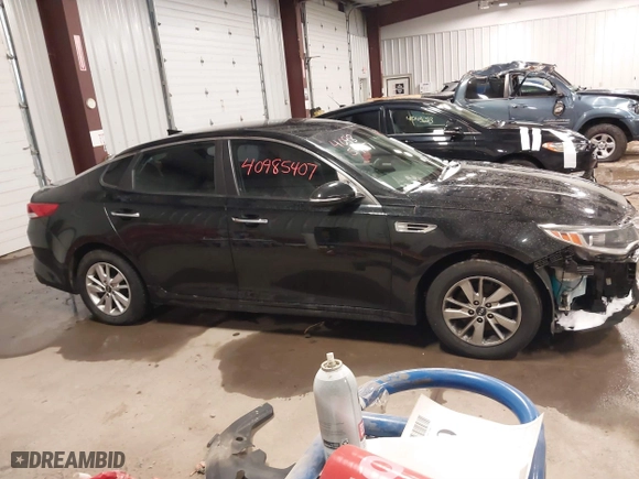 2017 Kia Optima LX with VIN 5XXGT4L31HG165150, listed as a IAAI auction lot 40985407 with 154,945 mi miles. Bid and sale history available at carsss.com. Image 12.