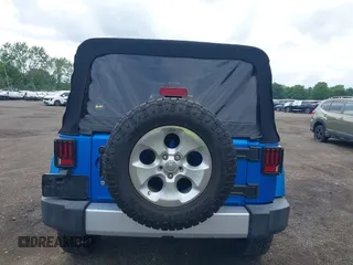 2015 Jeep Wrangler Unlimited Sahara with VIN 1C4BJWEG4FL677879, listed as a IAAI auction lot 42676097 with 85,821 mi miles and . Bid and sale history available at DreamBid. Image 16.