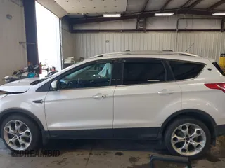 2013 Ford Escape Titanium with VIN 1FMCU9J96DUC60268, listed as a IAAI auction lot 42095407 with 105,307 mi miles and . Bid and sale history available at DreamBid. Image 14.