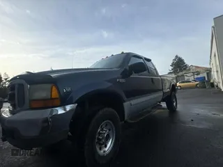 2001 Ford F-350 XL with VIN 1FTSX31S51EA11912, listed as a Copart auction lot 87827385 with 198,000 mi miles and Clean Title. Bid and sale history available at DreamBid. Image 2.