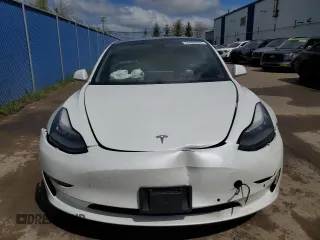 2019 Tesla Model 3 Mid Range z VIN 5YJ3E1EA0KF428001, wystawiony jako Copart lot #58480685 z przebiegiem 182 144 mil mil oraz Szkoda całkowita • Salvage title. Historia ofert i sprzedaży dostępna na DreamBid. Obrazek 5.