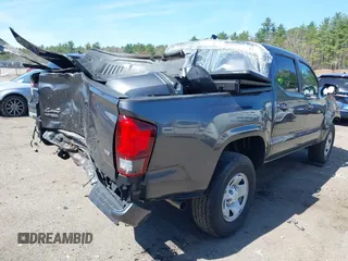 2023 Toyota Tacoma SR with VIN 3TMCZ5AN0PM614127, listed as a IAAI auction lot 41974924 with 12,674 mi miles and . Bid and sale history available at DreamBid. Image 4.