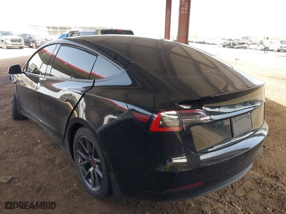2022 Tesla Model 3 Long Range with VIN 5YJ3E1EBXNF185973, listed as a IAAI auction lot 41692577 with 131,513 mi miles. Bid and sale history available at carsss.com. Image 3.