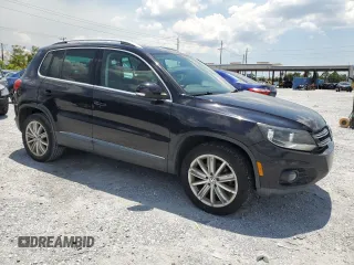 2014 Volkswagen Tiguan SE z VIN WVGAV3AX8EW613762, wystawiony jako Copart lot #61385765 z przebiegiem 167 278 mil mil oraz Czysty tytuł • Clean title. Historia ofert i sprzedaży dostępna na DreamBid. Obrazek 4.