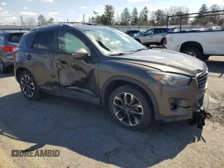 2016 Mazda CX-5 Grand Touring with VIN JM3KE4DY1G0806674, listed as a Copart auction lot 50549465 with 139,753 mi miles and Salvage Title. Bid and sale history available at carsss.com. Image 4.