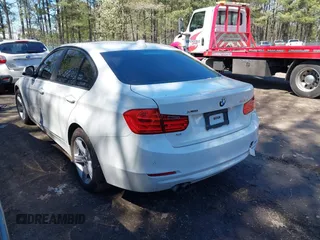 2014 BMW 3 Series 328i xDrive with VIN WBA3B3C55EJ979836, listed as a IAAI auction lot 41886624 with 140,684 mi miles. Bid and sale history available at carsss.com. Image 3.