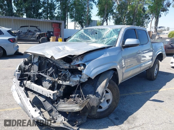 2018 Toyota Tacoma SR with VIN 5TFAX5GN2JX103685, listed as a IAAI auction lot 42392032 with 138,678 mi miles and . Bid and sale history available at DreamBid. Image 2.
