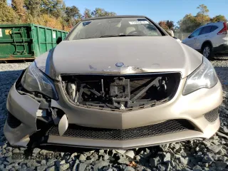 2016 Mercedes-Benz E 400 with VIN WDDKK6FF8GF334288, listed as a Copart auction lot 77405814 with 115,728 mi miles and Salvage Title. Bid and sale history available at carsss.com. Image 5.