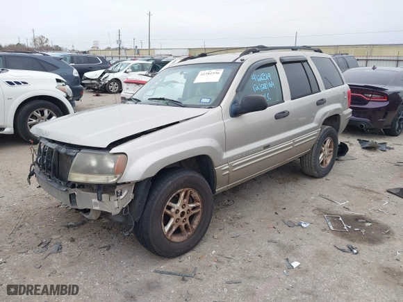 2004 Jeep Grand Cherokee Laredo with VIN 1J4GX48S44C301120, listed as a IAAI auction lot 41281556 with 267,246 mi miles. Bid and sale history available at carsss.com. Image 2.