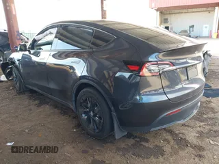 2024 Tesla Model Y with VIN 7SAYGDED9RF053203, listed as a IAAI auction lot 41906729 with Not Provided miles and . Bid and sale history available at DreamBid. Image 3.