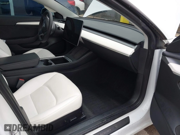 2023 Tesla Model 3 with VIN 5YJ3E1EA5PF505856, listed as a IAAI auction lot 41885837 with 28,206 mi miles and . Bid and sale history available at carsss.com. Image 5.