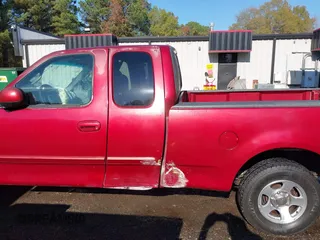 2000 Ford F-150 XL with VIN 1FTRX17L7YKA59717, listed as a IAAI auction lot 40887691 with 104,095 mi miles. Bid and sale history available at carsss.com. Image 14.