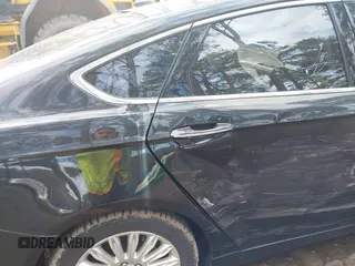 2015 Ford Fusion SE Hybrid with VIN 3FA6P0LU5FR190333, listed as a IAAI auction lot 41802327 with 256,747 mi miles. Bid and sale history available at carsss.com. Image 6.