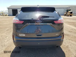 2020 Ford Edge SE с VIN 2FMPK3G9XLBA36257, выставлен на аукционе Copart как лот 57227695 с пробегом 90 588 миль миль и Списание • Salvage title. История ставок и продаж доступна на DreamBid. Изображение 6.