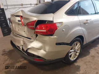 2016 Ford Focus SE z VIN 1FADP3F24GL393913, wystawiony jako IAAI lot #42640803 z przebiegiem 89 547 mil mil oraz . Historia ofert i sprzedaży dostępna na DreamBid. Obrazek 12.