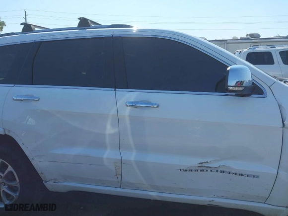 2014 Jeep Grand Cherokee Overland with VIN 1C4RJFCTXEC128443, listed as a IAAI auction lot 40512681 with 126,379 mi miles. Bid and sale history available at carsss.com. Image 14.