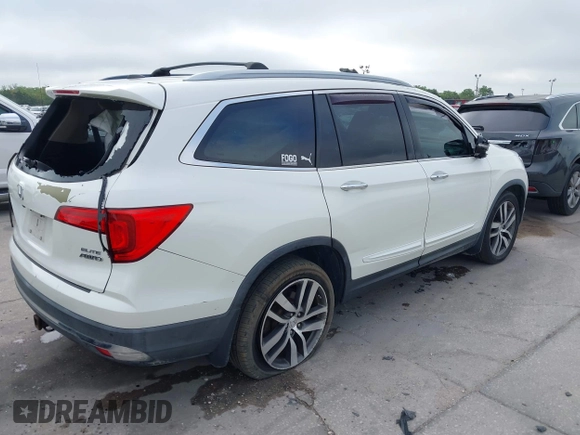 2016 Honda Pilot Elite with VIN 5FNYF6H00GB104329, listed as a IAAI auction lot 41905390 with 125,501 mi miles. Bid and sale history available at carsss.com. Image 4.