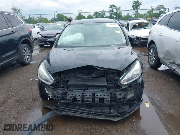 2017 Ford Focus SE z VIN 1FADP3F25HL253466, wystawiony jako IAAI lot #42303404 z przebiegiem 89 779 mil mil oraz . Historia ofert i sprzedaży dostępna na DreamBid. Obrazek 13.