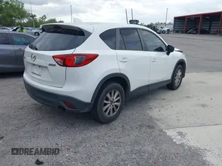 2015 Mazda CX-5 Touring with VIN JM3KE2CY8F0545967, listed as a IAAI auction lot 41909920 with 101,781 mi miles. Bid and sale history available at carsss.com. Image 4.
