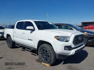 2021 Toyota Tacoma SR z VIN 3TYAX5GN5MT014868, wystawiony jako IAAI lot #41549927 z przebiegiem 30 653 mil mil oraz . Historia ofert i sprzedaży dostępna na DreamBid. Obrazek 1.