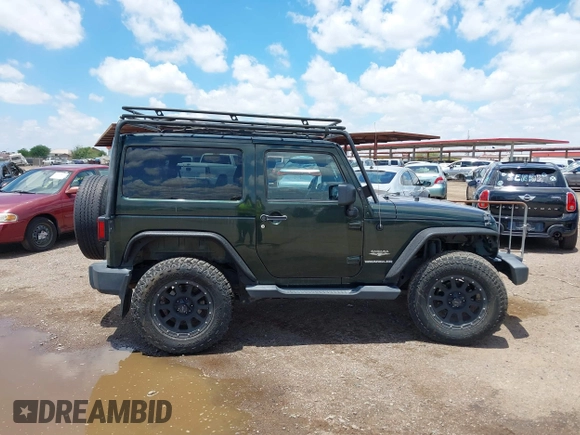 2012 Jeep Wrangler Sahara z VIN 1C4AJWBGXCL100527, wystawiony jako IAAI lot #42394623 z przebiegiem 126 097 mil mil oraz . Historia ofert i sprzedaży dostępna na DreamBid. Obrazek 13.