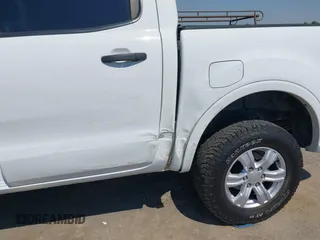 2021 Ford Ranger XL z VIN 1FTER4EH5MLE05003, wystawiony jako IAAI lot #42649042 z przebiegiem 62 571 mil mil oraz . Historia ofert i sprzedaży dostępna na DreamBid. Obrazek 6.