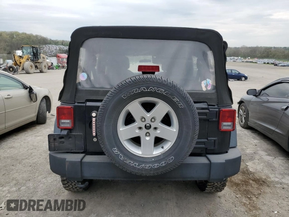 2015 Jeep Wrangler Unlimited Willys Wheeler with VIN 1C4BJWDG3FL601197, listed as a Copart auction lot 53832465 with 216,141 mi miles and Salvage Title. Bid and sale history available at DreamBid. Image 6.