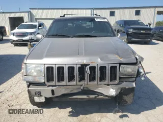 1998 Jeep Grand Cherokee Limited with VIN 1J4GZ78S5WC325148, listed as a Copart auction lot 67780424 with 0 mi miles and Salvage Title. Bid and sale history available at carsss.com. Image 5.