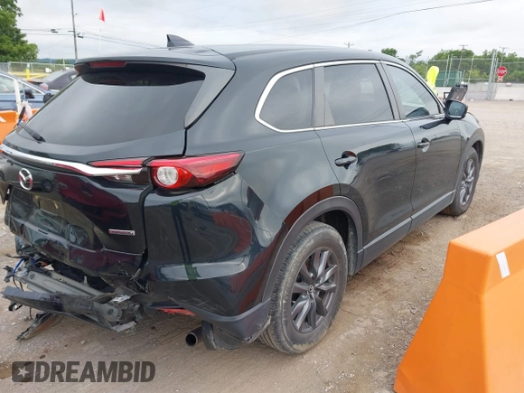 2021 Mazda CX-9 Sport with VIN JM3TCABY6M0522352, listed as a IAAI auction lot 42613136 with 106,167 mi miles and . Bid and sale history available at DreamBid. Image 4.