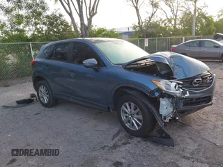 2016 Mazda CX-5 Sport with VIN JM3KE2BY9G0890914, listed as a IAAI auction lot 42440241 with 69,070 mi miles and . Bid and sale history available at DreamBid. Image 1.