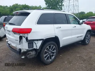 2018 Jeep Grand Cherokee Limited with VIN 1C4RJFBG8JC417240, listed as a IAAI auction lot 42476411 with 77,080 mi miles and . Bid and sale history available at DreamBid. Image 6.