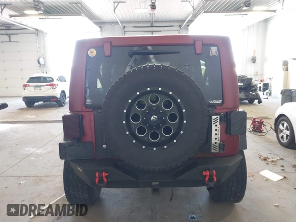 2011 Jeep Wrangler Unlimited Rubicon with VIN 1J4BA6H18BL584486, listed as a IAAI auction lot 42340661 with 152,896 mi miles and . Bid and sale history available at DreamBid. Image 16.