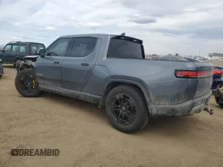 2023 Rivian R1T Adventure with VIN 7FCTGAAA3PN000801, listed as a Copart auction lot 51600895 with 19,486 mi miles and Salvage Title. Bid and sale history available at carsss.com. Image 2.