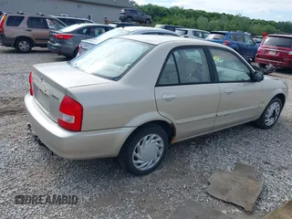 2001 Mazda Protege LX z VIN JM1BJ226210439446, wystawiony jako IAAI lot #42336976 z przebiegiem 155 990 mil mil oraz . Historia ofert i sprzedaży dostępna na DreamBid. Obrazek 4.