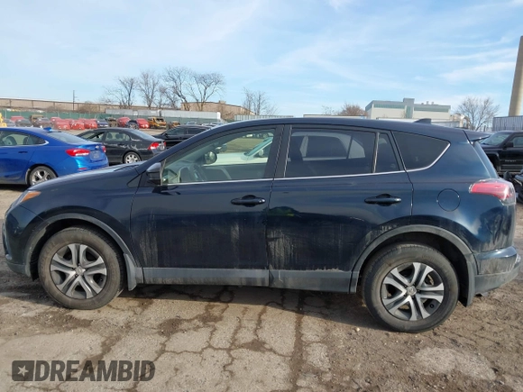 2018 Toyota RAV4 LE with VIN JTMBFREV5JD253342, listed as a IAAI auction lot 41656581 with 243,791 mi miles and . Bid and sale history available at DreamBid. Image 15.